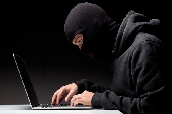 bigstock-Computer-hacker-in-a-balaclava-53815411
